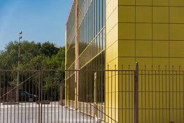 Obraz na płótnie Canvas Yellow building glass facade