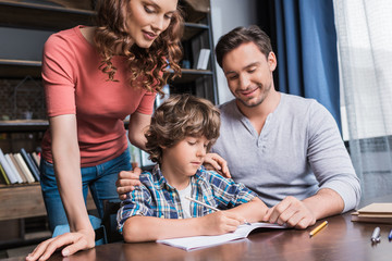 parents helping son with homework