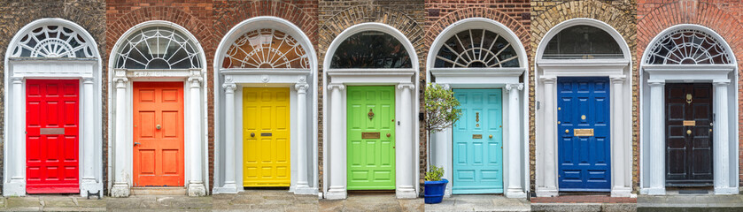 Panoramic rainbow colors collection of typical irish georgian doors of Dublin, Ireland - obrazy, fototapety, plakaty