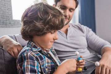 kid building atoms model