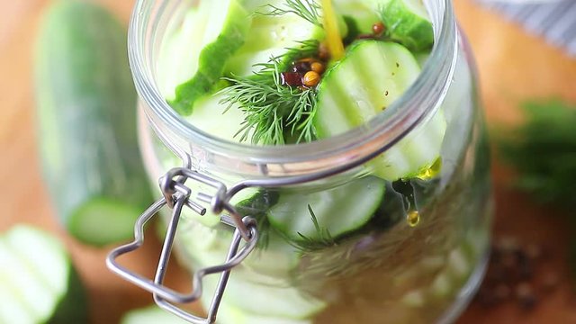 Making homemade pickles in a glass jar