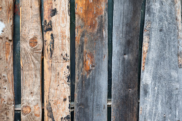 Window boarded up with wooden planks closeup shot