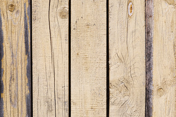 Old wooden fence fragment with faded paint, abstract texture