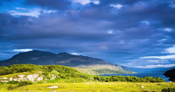 timelapse of clouds and sunlight moving over loch maree and slioch in the torridon region of scotland during a summer evening