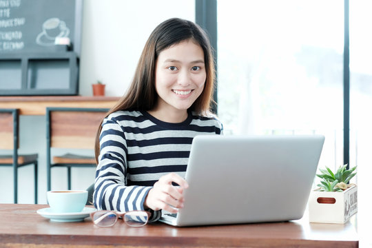 Young asian woman using laptop computer in casual lifestyles, people and technology, lifestyles