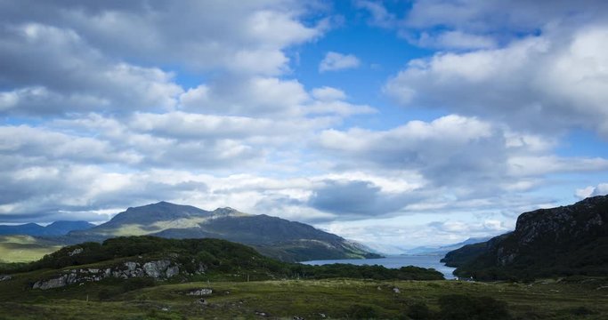 timelapse of clouds and sunlight moving over loch maree and slioch in the torridon region of scotland during a summer evening