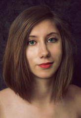 Close up portrait of young white woman with green eyes