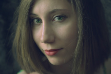 Close up portrait of young white woman with green eyes