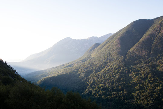 Mountain range at dawn in abruzzo with barrea lake in the background. Green mountains