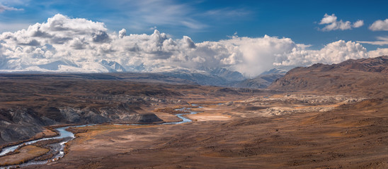 Altai Mountains,Russia.Unique "Martian" landscape of a very unusual area, located near the border of Russia, China, Mongolia and Kazakhstan. Picturesque  Landscape From Multi-Colored Clays And River