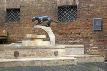 Panther monument at the contrada border, Siena, Tuscany, Italy © Maurizio