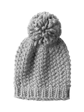 Gray woolen winter cap hat with a pom pom pompon isolated on white