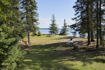Campsite with picnic and campfire areas next to the hiking trail to Grey Owl's cabin on the shore...