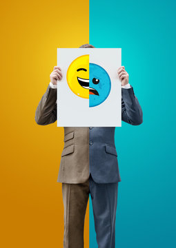 Businessman Holding Happy and Sad Emoticon Faces. Concept