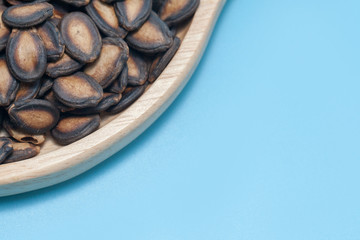 dried watermelon seed on wooden plate