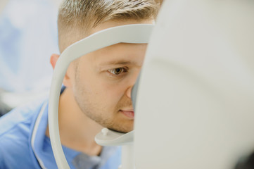 close up head of young patient fix in Tomography in Optical Coherence © Med Photo Studio