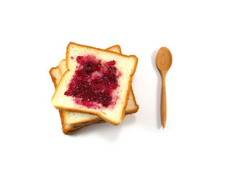 Breads with blueberry jam on white background