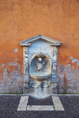 A drinking fountain in Rome located on Via della Conciliazione on the way to St. Peter's Basilica