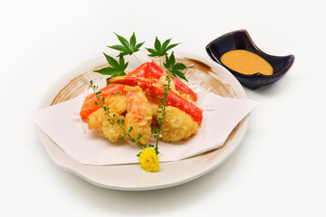 Deep fried crab claws with spicy creamy sauce Japanese style on white background