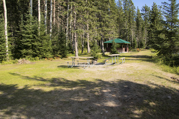 Campsite with picnic and campfire areas next to the hiking trail to Grey Owl's cabin on the shore...