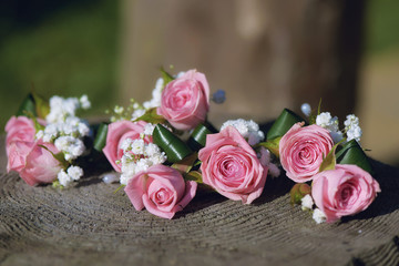 Floral statement for rustic minimalist wedding theme with roses and baby's-breath and shallow depth of field