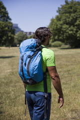 Naklejka premium Young handsome hiker in the field