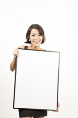 Beautiful young woman holding a blank sheet of paper