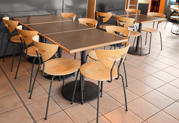 Modern cafeteria with tables and chairs