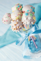 Homemade assorted cake pops with multi colored sprinkles, sweet food ideas for kids, closeup with selective focus