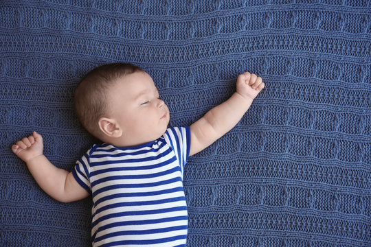 Cute Little Baby Sleeping On Bed