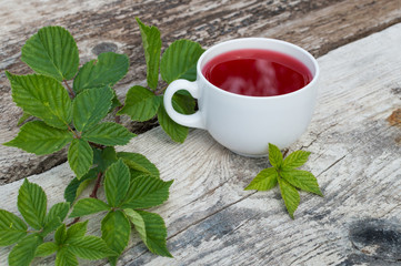 Cup of tea and blackberry plate