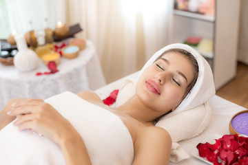 Attractive young and healthy woman in spa salon is having massage, Spa, health and healing concept.