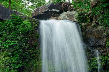 Obraz premium Beautiful waterfall in green forest in jungle , Thailand