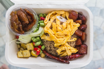 rice mixed with shrimp paste in paper plate