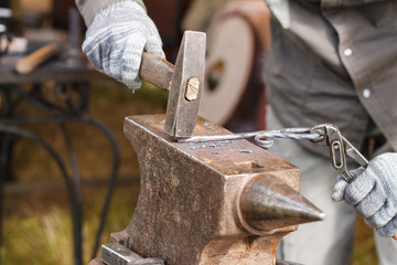 Blacksmith working on metal