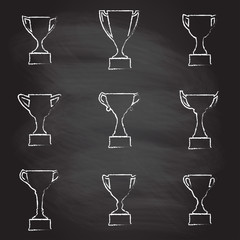 Trophy Cup icon set isolated on blackboard texture with chalk rubbed background. Vector illustration.