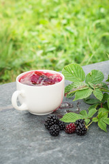 Cup of tea and blackberry