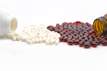 red and white pills on a white background