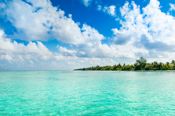 Beautiful cloudy panoramic landscape of sandy beach in Indian ocean, Maldives