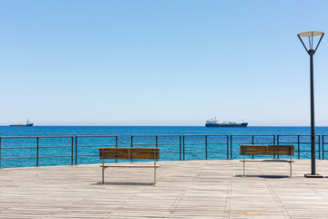 Fototapeta na wymiar Wooden pier on the Limassol's seafront promenade. Cyprus