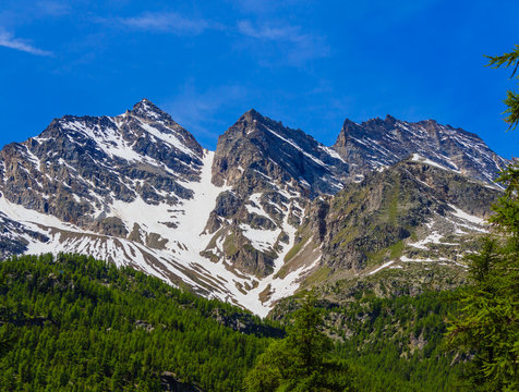 view of the Three Levanne,are the most famous  mountains in the National Park of Great Paradise,in Piedmont,Italy/  the mountains Three Leavanne with their 3500 metres height,are covered with snow