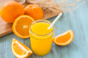 Orange Juice in Mason Jar With Wheat Grass