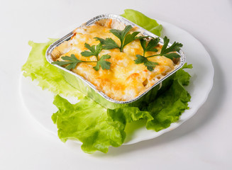 Potato gratin on the foil case box dish