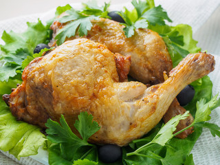 chicken fried legs with vegetables on the plate