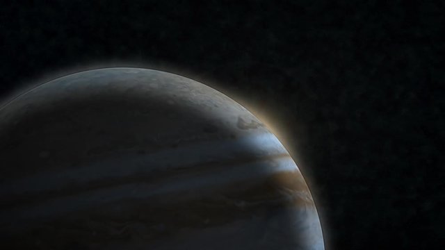 The sun bursts into view over Jupiter's horizon and illuminates the surface. Data: NASA/JPL.