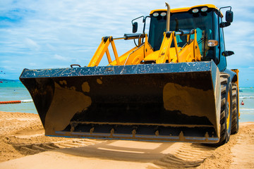 Excavator, ground and sand digger, beach