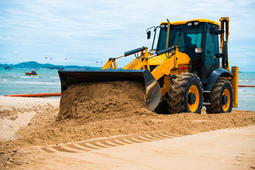 Obraz na płótnie Canvas Excavator, ground and sand digger, beach