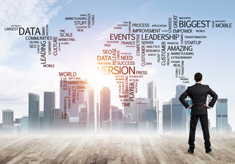 Motivation and inspiration concept with modern cityscape and businessman observing it