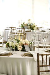 Elegant place settings at outdoor wedding reception