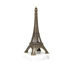 Paris Eiffel tower souvenir on the marble stand isolated on white background